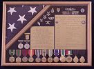 My shadowbox, containing my retirement flag, medals and awards, list of assignments and other mementos.